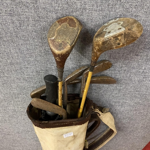 Vintage golf clubs and bag