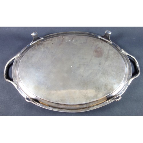 407 - George III Irish silver oval tray with reeded rim and loop handles, chased with a floral border, swa... 
