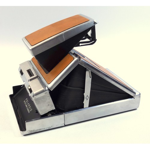 53 - Early poloroid camera sx-70, 1972, model 1 aluminium and Leather, serial number h303463038, in leath... 