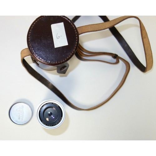 60 - An Ernest Leitz Wetzlar Leica lens, Elmar f-9cm in brown leather carrying case, and a Leitz Leica  T... 