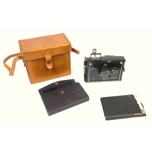 63 - A Plaubel Makina folding camera with accessories, cased