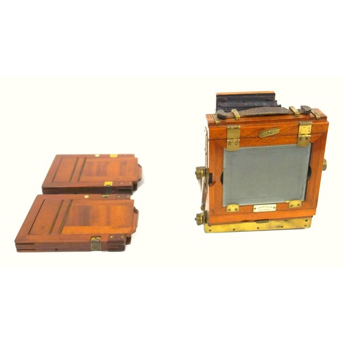 64 - A 19th century Ashford’s Patent, mahogany cased folding field camera, together with two plate holder... 