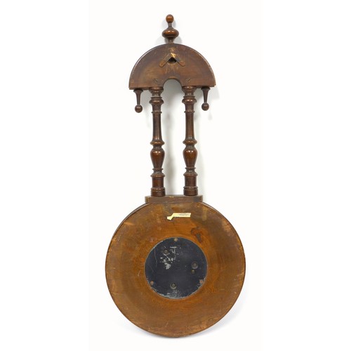 66 - Late Victorian barometer with a circular dial enclosing an aneroid movement, in a carved walnut fini... 