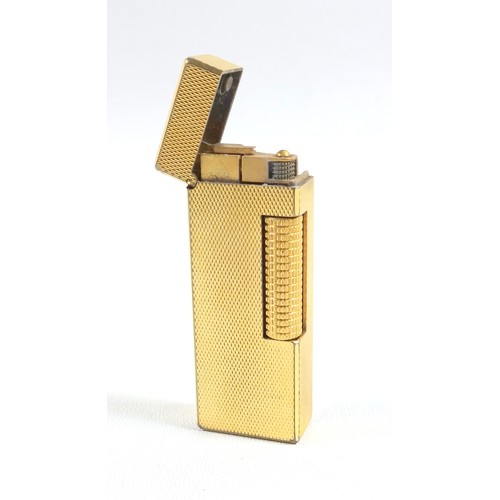 79 - A gold Plated Dunhill lighter in original fitted case, together with an Omega wrist watch and a felt... 