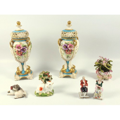119 - Pair of early 20th century continental porcelain vases and covers, each of ovoid form with reticulat... 