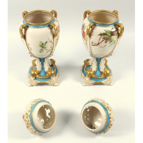 119 - Pair of early 20th century continental porcelain vases and covers, each of ovoid form with reticulat... 