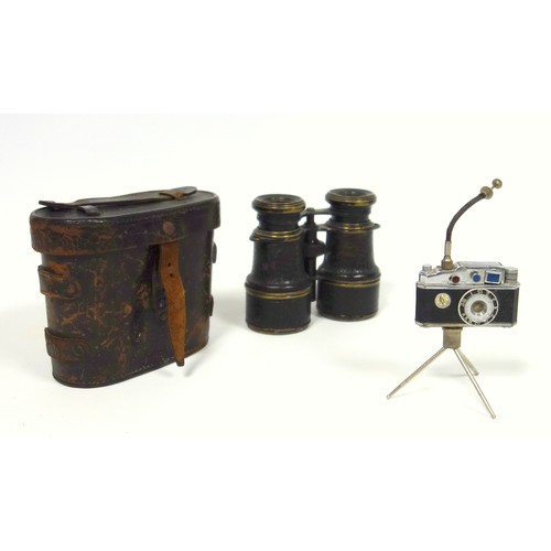56 - A KKW miniature camera lighter with integral compass on a tripod, together with a pair of military b... 