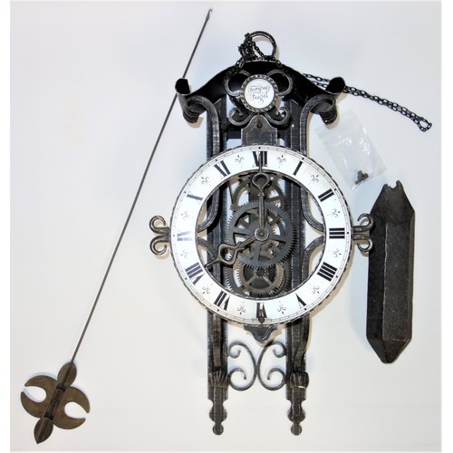 84 - An antique style Continental clock movement constructed from old parts with wrought iron supports.