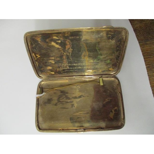 54 - A George V 9ct gold cigarette case of cushion form with stripped engine turned decoration, Birmingha... 