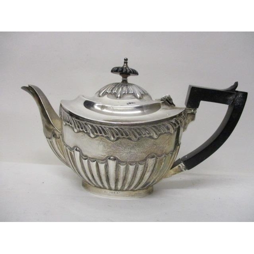 9 - An Edwardian silver teapot by Charles Westwood & Son, Birmingham 1905 with gadrooned and reeded ... 