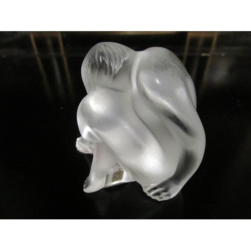 1 - Marie Claude Lalique for Lalique Glass - a satin frosted and colourless figure of a nude in crouchin... 