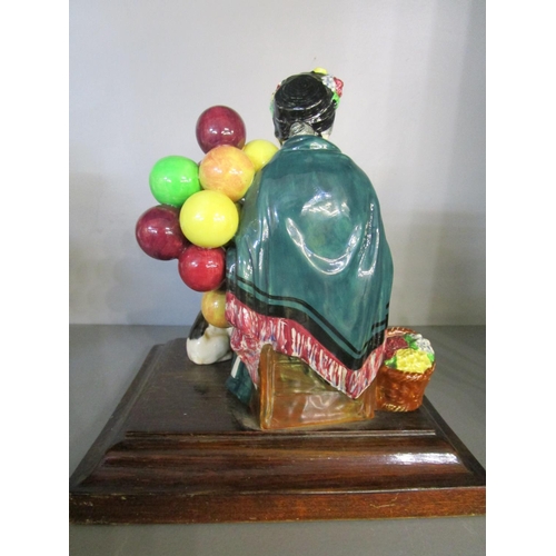 26 - Leslie Harridene for Royal Doulton - Old Balloon Seller with Bulldog mounted on a wooden plinth, HN1... 