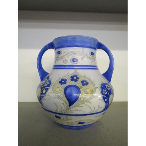 34 - A William Moorcroft design for Moorcroft Pottery, a twin handled vase decorated in a Persian style f... 