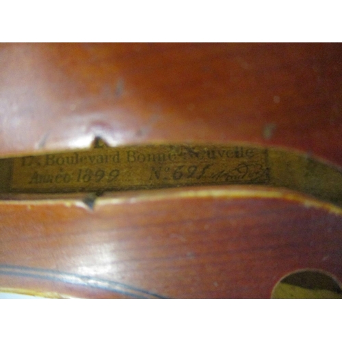 296 - A late 19th century violin with a N Audinot label, 1899 No 695 in pencil with a two piece back and i... 