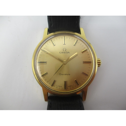 27 - An Omega gold plated gents manual wind wristwatch having a gilt dial with central seconds, on a late... 