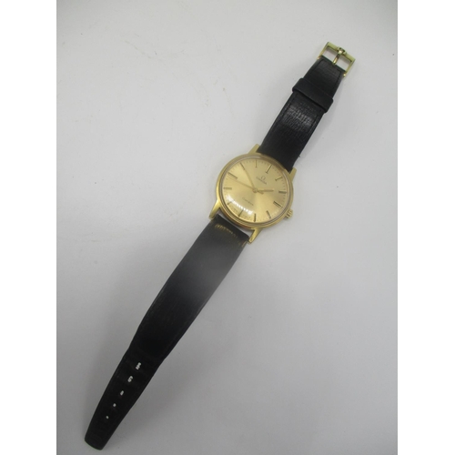 27 - An Omega gold plated gents manual wind wristwatch having a gilt dial with central seconds, on a late... 