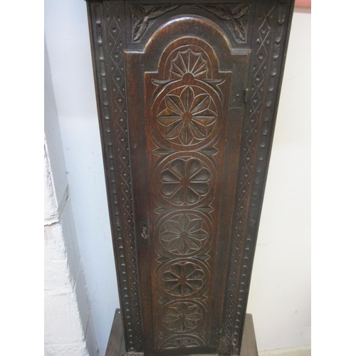 67 - An early 18th century and later longcase clock in a carved oak case. The brass dial having date chap... 