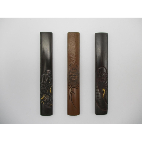 99 - A group of three Japanese Katana Kozuka fittings, of mixed metals, the copper one signed, the other ... 