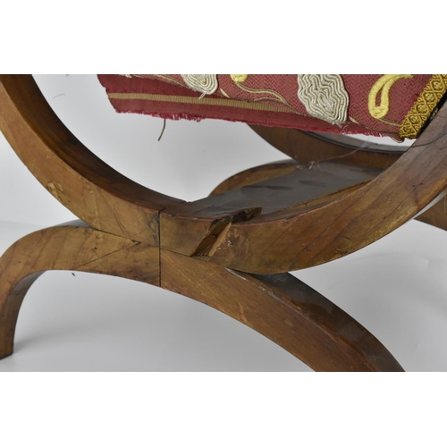 49 - A 19th century Biedermeier upholstered window seat or curule stool, with later upholstery, designed ... 