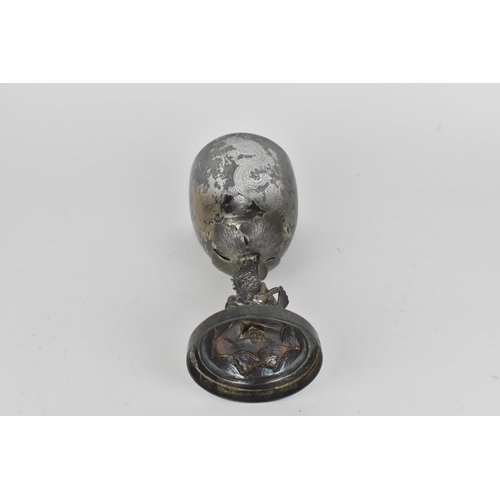 15 - A Chinese export silver goblet modelled with a dolphin stem on a circular base, the dolphin with det... 