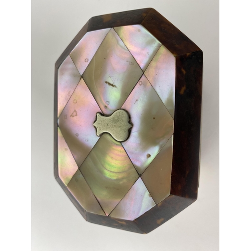 157 - A Mid 19th century mother of pearl and tortoiseshell tea caddy of octagonal form, the hinged lid enc... 