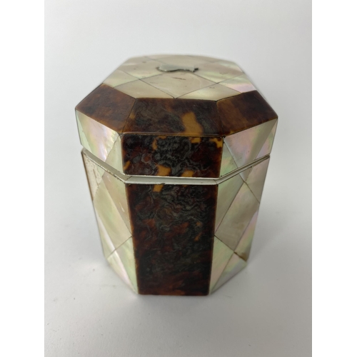 157 - A Mid 19th century mother of pearl and tortoiseshell tea caddy of octagonal form, the hinged lid enc... 