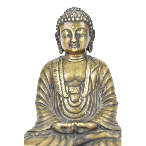 111A - A Sino-Tibetan lacquered bronze or brass statue of Buddha in Dhyana Mudra on a casted base with Vijr... 