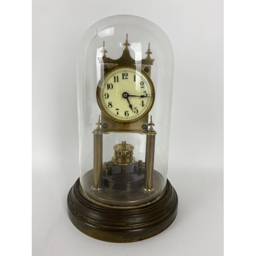 15 - An early 20th century Gustav Becker anniversary clock with glass dome, the movement numbered 2268031... 