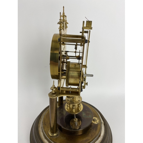 15 - An early 20th century Gustav Becker anniversary clock with glass dome, the movement numbered 2268031... 