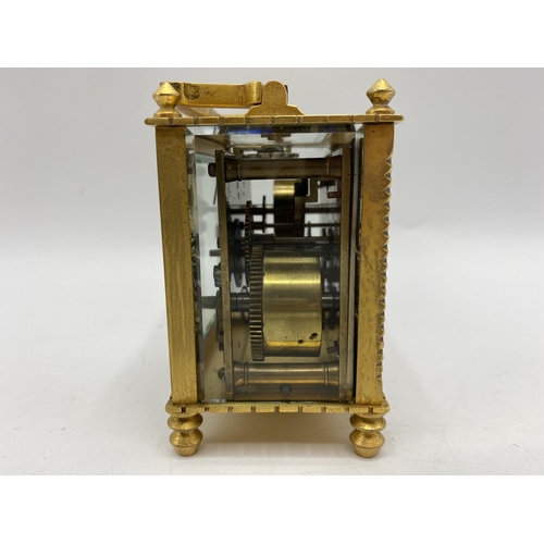 18 - An early 20th century square formed alarm carriage clock, the white enamel dial having Arabic numera... 