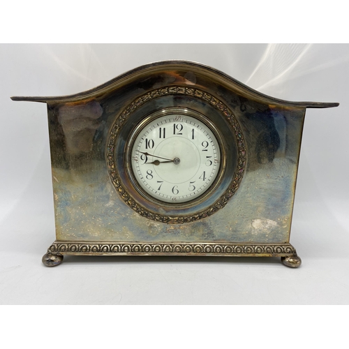 36 - A circa 1900 silver plated mantle clock, possibly by Liberty & Co, the white enamel dial having Arab... 