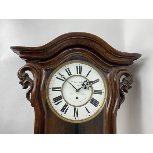 44 - A late 19th century walnut 8 day Vienna regulator wall clock, the circular dial having black Roman n... 