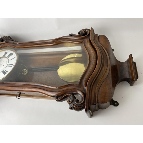 44 - A late 19th century walnut 8 day Vienna regulator wall clock, the circular dial having black Roman n... 