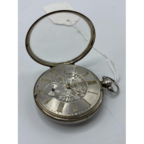 53 - A Victorian silver cased open faced lever pocket watch having a silvered dial with machine turned fl... 