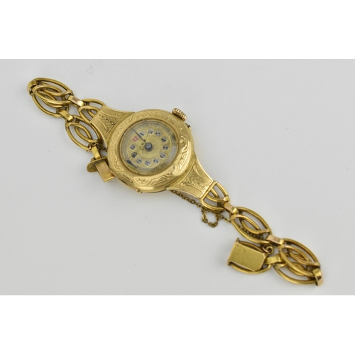 26 - A Swiss early 20th century ladies 18ct gold cylinder wristwatch. The dial signed T.R.F with chaptere... 