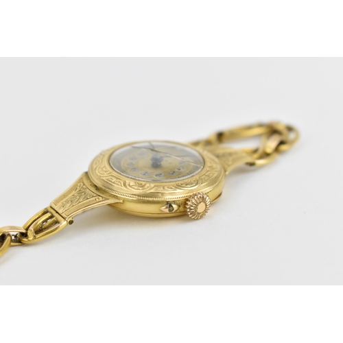 26 - A Swiss early 20th century ladies 18ct gold cylinder wristwatch. The dial signed T.R.F with chaptere... 