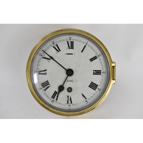 4 - An early/mid 20th century brass cased ships bulkhead clock, the 6 inch dial having Roman numerals, s... 