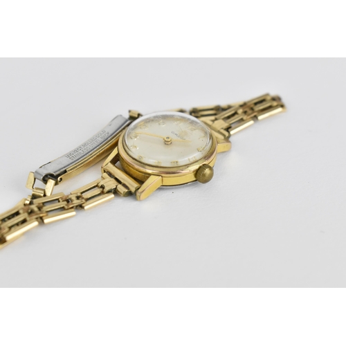43 - A 1965 Omega ladies gold plated wristwatch having a silvered dial with Arabic numerals, 17 jewels 62... 