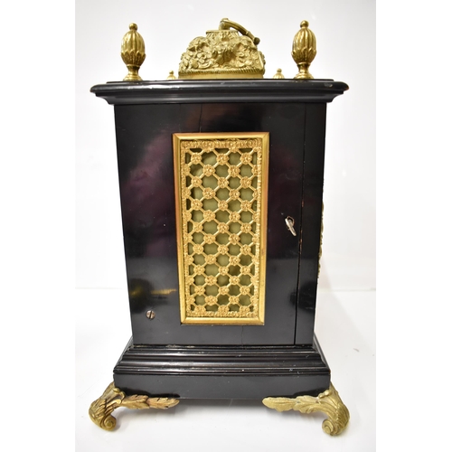 7 - A 19th century ebonised and gilt metal mantel clock by Payne & Co, the case having gilt metal top de... 
