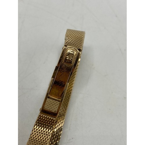 48 - A Tissot ladies 9ct yellow gold manual wind wristwatch, the silvered dial having baton markers and o... 
