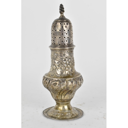 17 - An 18th century silver pepper pot, possibly by T *, London 1778, of baluster form with embossed flor... 
