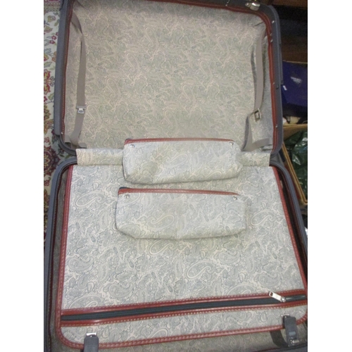 24 - Three Samsonite suitcases with mid brown leather handles and trim together with a black Antler suit ... 