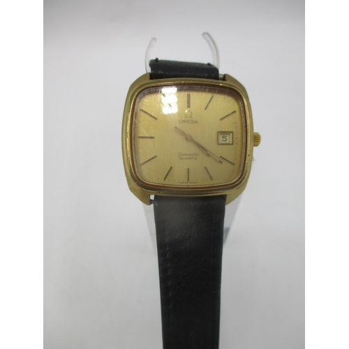 10 - A 1970's Omega gents gold coloured dial wristwatch with date aperture and black leather strap
Condit... 