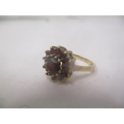 21 - A 9ct gold ring set with garnets
Location: CAB
