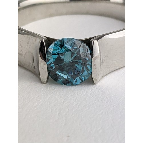5 - A solitaire aqua coloured diamond ring approx 0.8ct in a platinum curved setting, size