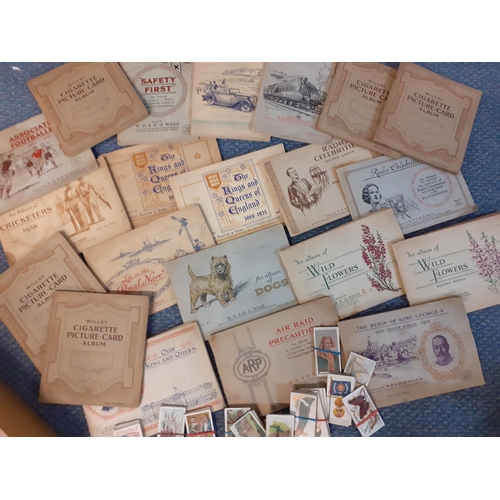 39 - Twenty one early to mid 20th century collectors cigarette card albums to include Wills Railway equip... 