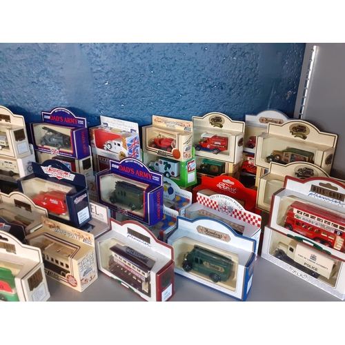 42 - A collection of boxed die cast vehicles, mainly vintage vans and buses to include Lledo, Days Gone, ... 