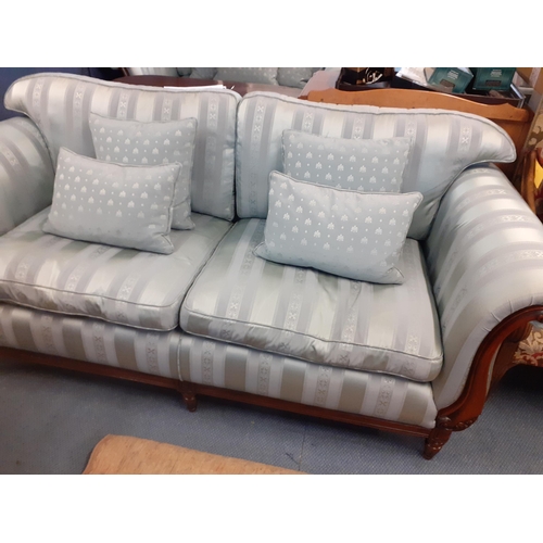 58 - A Medallion blue striped large two seater sofa with scrolled show wood arms and four scatter cushion... 