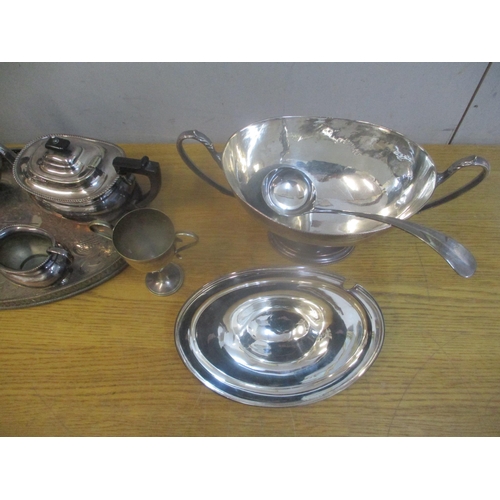 20 - Silver plate to include a navette shaped soup tureen and ladle, a four piece tea service, on tray wi... 
