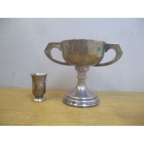 26 - A silver trophy cup, 280g and a silver coloured metal cup stamped 830, 33g
Location: 4.1